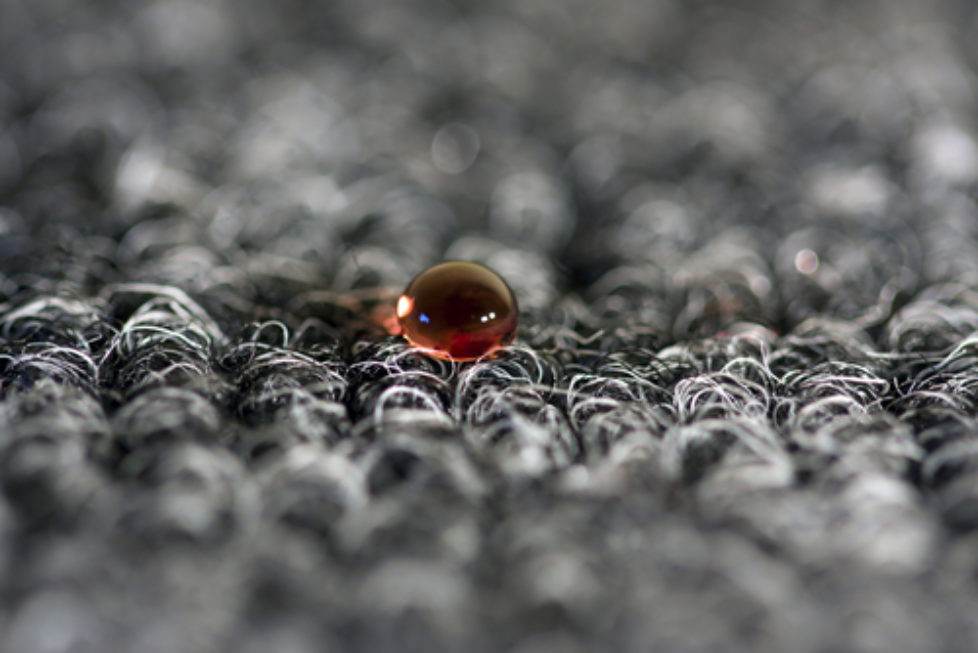 blood drop of grey carpet close up